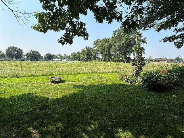 601 Holiday Dr, Effingham, IL 62401 - view of grassy yard with an outdoor fire pit