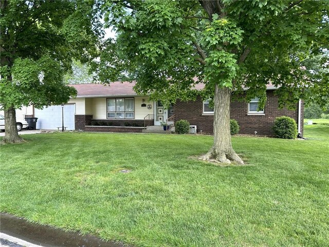 601 Holiday Dr, Effingham, IL 62401 - view of front of property with brick siding and a front lawn