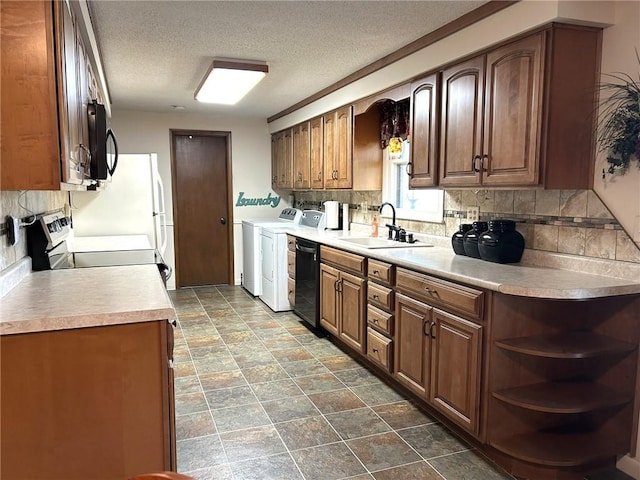 601 Holiday Dr, Effingham, IL 62401 - kitchen featuring washing machine and clothes dryer, black appliances, tasteful backsplash, open shelves, and a textured ceiling