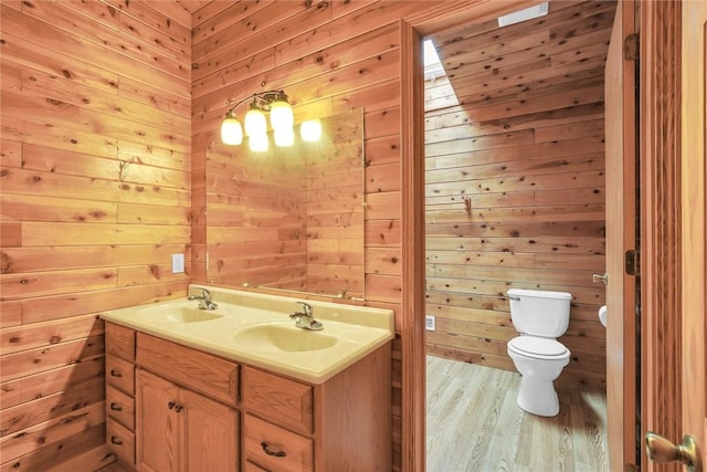 9092 N County Road 2150 E, Ashmore, IL 61912 - full bathroom with toilet, wood finished floors, wooden walls, and double vanity