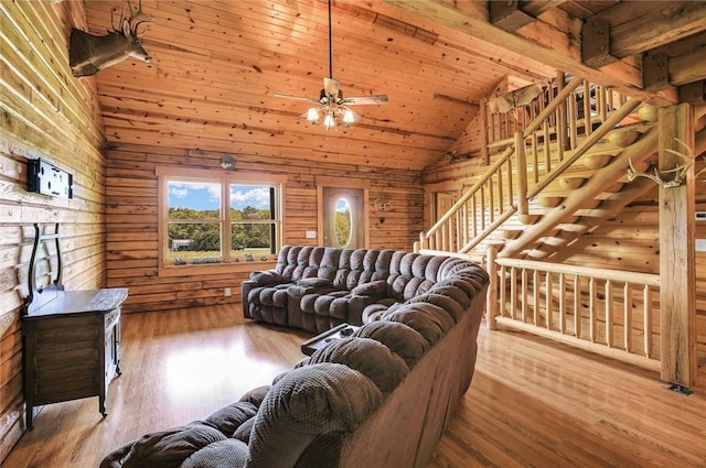 9092 N County Road 2150 E, Ashmore, IL 61912 - living room with lofted ceiling, a ceiling fan, wood walls, wood finished floors, and wood ceiling