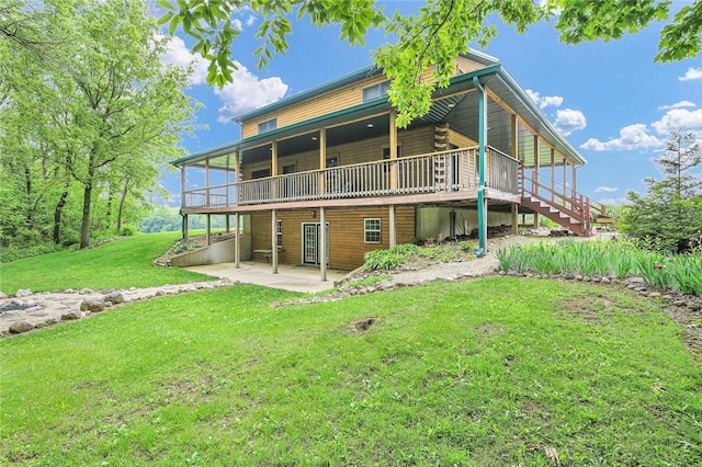 9092 N County Road 2150 E, Ashmore, IL 61912 - rear view of property with a patio, a wooden deck, a yard, and stairs