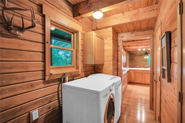 9092 N County Road 2150 E, Ashmore, IL 61912 - washroom with wooden walls, washing machine and clothes dryer, wood ceiling, and light wood-style flooring