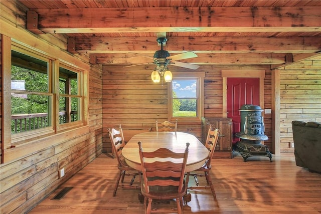 9092 N County Road 2150 E, Ashmore, IL 61912 - dining room featuring wooden walls, wood finished floors, wood ceiling with exposed beams, and a ceiling fan