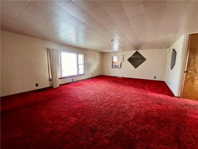 unfurnished room featuring cooling unit and carpet flooring