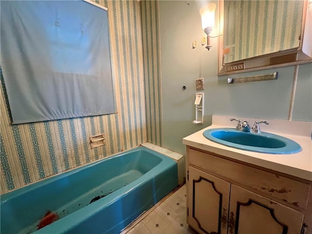 bathroom featuring vanity and a tub