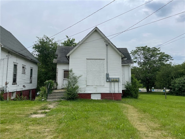 back of house with a yard