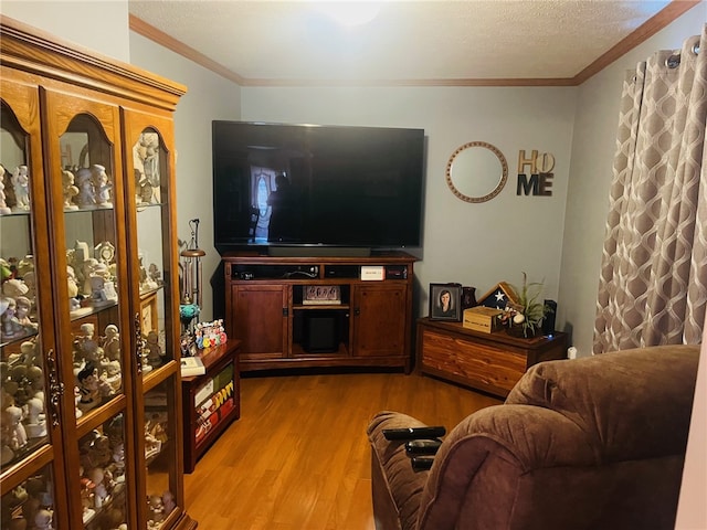 living room with light hardwood / wood-style floors and ornamental molding