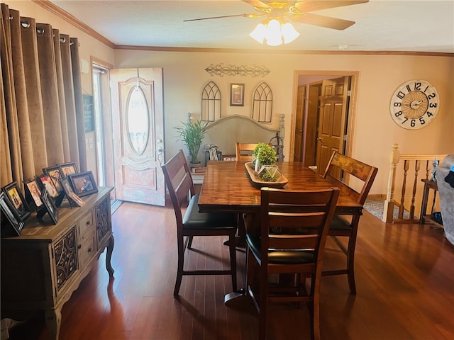 dining space featuring ceiling fan, dark hardwood / wood-style floors, and ornamental molding