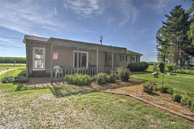 4111 Dye Rd, Illiopolis, IL 62539 - rear view of property featuring a yard