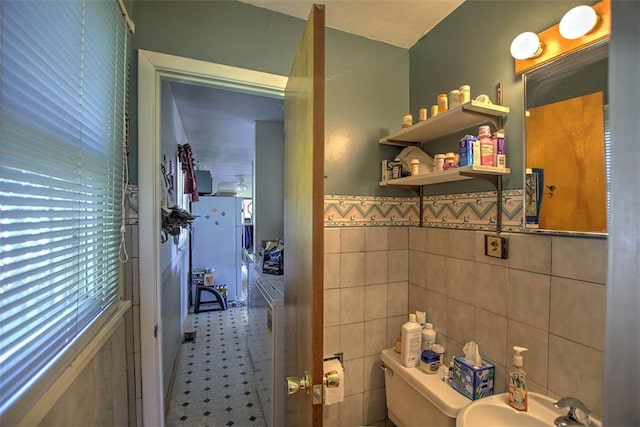 4111 Dye Rd, Illiopolis, IL 62539 - half bathroom featuring tile walls, tile patterned floors, and wainscoting