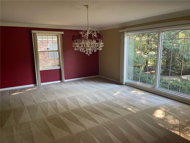 unfurnished dining area featuring carpet flooring, a notable chandelier, and ornamental molding