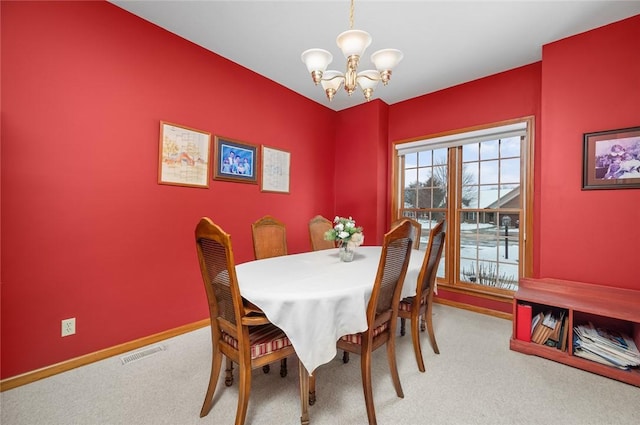 2 Rosewood Ct, Paris, IL 61944 - carpeted dining space with an inviting chandelier