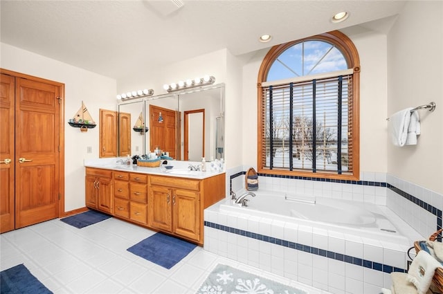 2 Rosewood Ct, Paris, IL 61944 - bathroom with vanity, tile patterned floors, and tiled tub