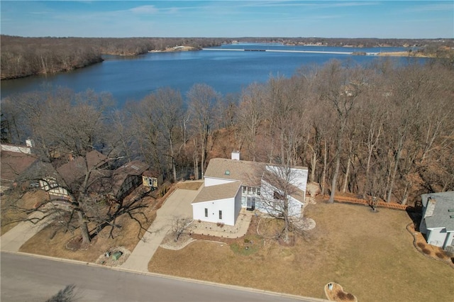 aerial view featuring a water view and a wooded view