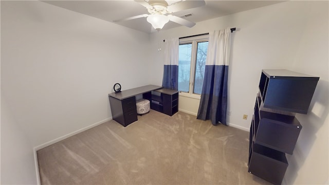 home office with ceiling fan, visible vents, baseboards, and light colored carpet