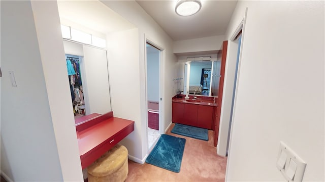 interior space with carpet floors and a sink