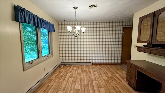 unfurnished dining area featuring light wood-type flooring, a baseboard radiator, and an inviting chandelier