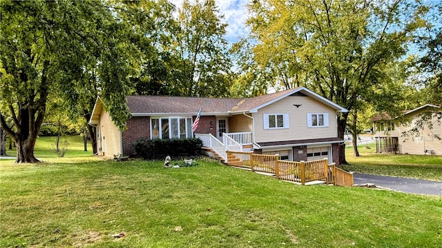 view of front of home with a garage and a front yard