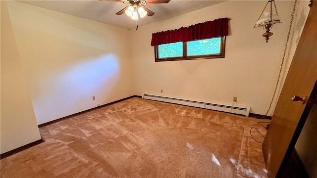 carpeted empty room with ceiling fan and a baseboard radiator