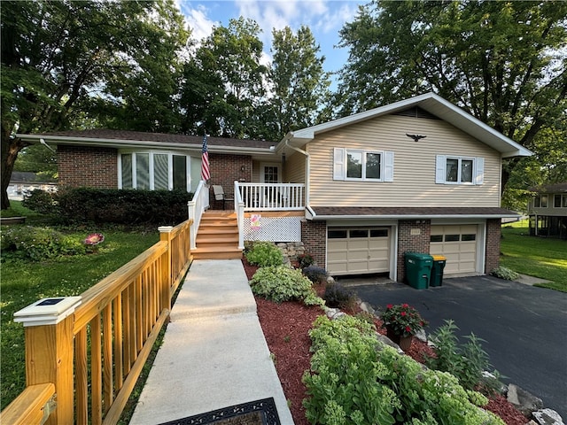 view of front of home with a porch and a garage