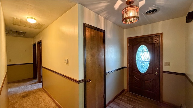 foyer entrance with hardwood / wood-style flooring