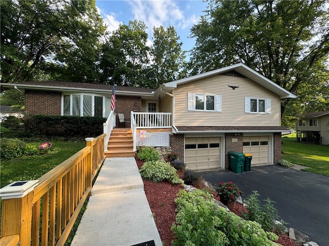 view of front of house featuring a porch and a garage