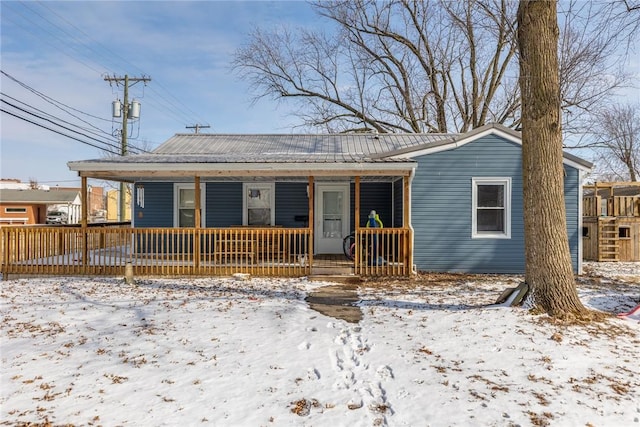 view of front of house featuring a porch and metal roof