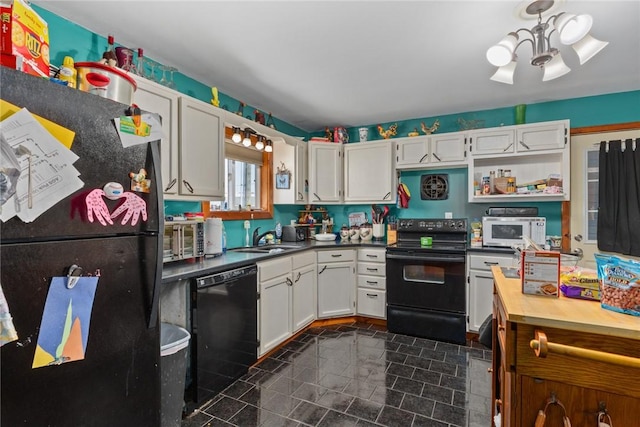 kitchen with white cabinets, open shelves, a sink, a chandelier, and black appliances