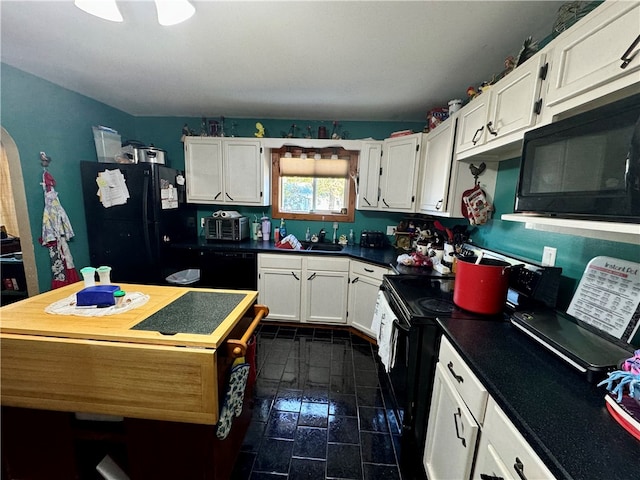 kitchen with sink, white cabinetry, and black appliances