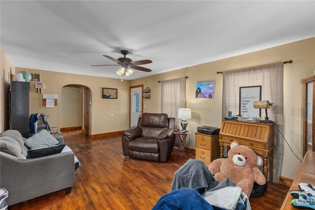 living room with ceiling fan and wood-type flooring