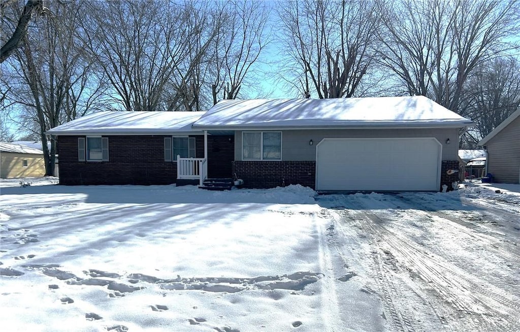 single story home with a garage