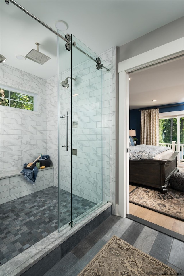 bathroom featuring hardwood / wood-style floors and walk in shower