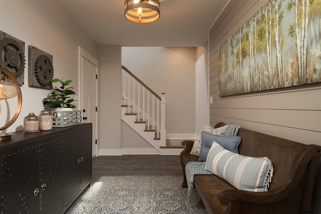 foyer entrance with dark tile floors