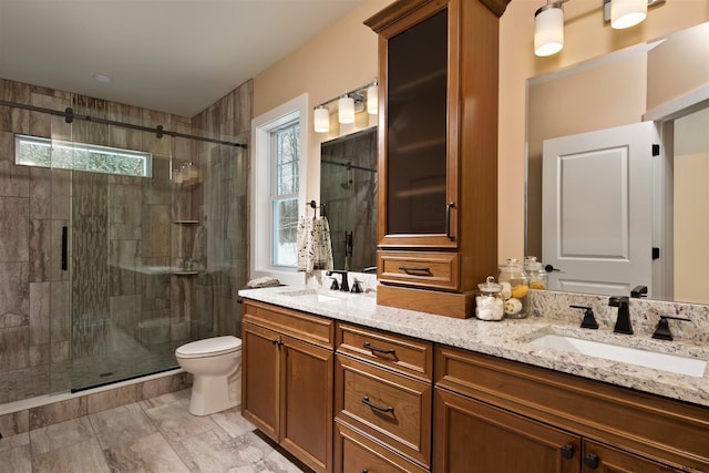 bathroom featuring walk in shower, toilet, double vanity, and tile flooring