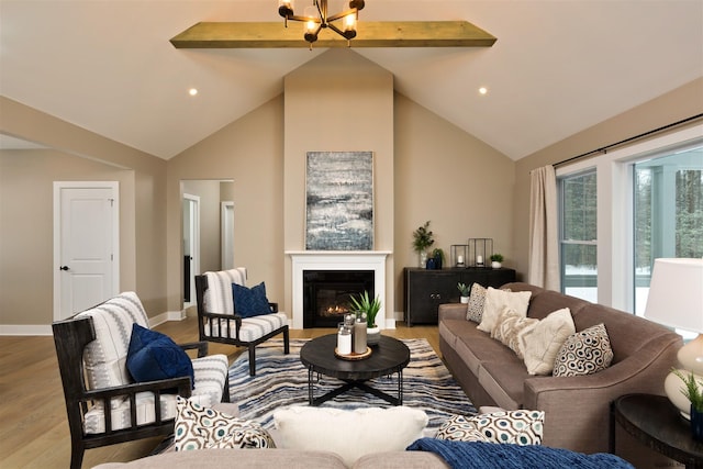 living room featuring an inviting chandelier, beam ceiling, high vaulted ceiling, and light wood-type flooring