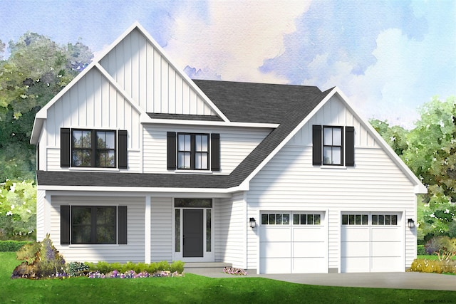 view of front of home featuring a front yard and a garage