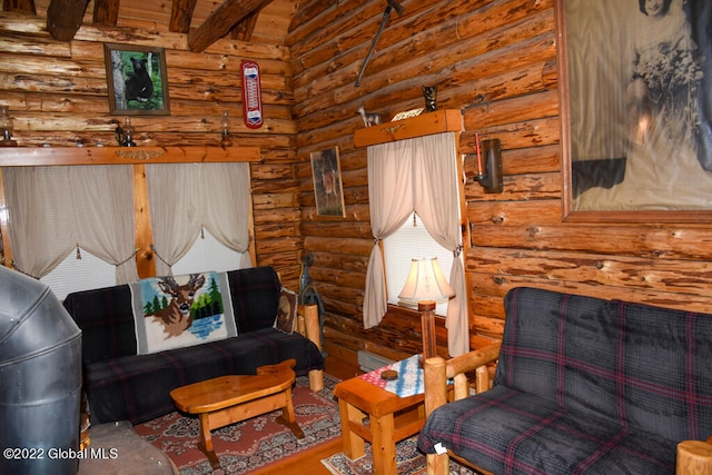 living room featuring hardwood / wood-style flooring and rustic walls