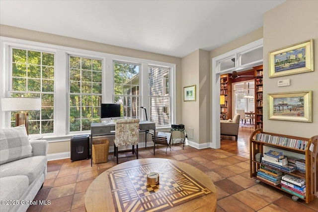 office space with baseboards