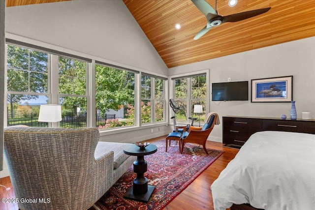 bedroom featuring wood ceiling, high vaulted ceiling, baseboards, and wood finished floors