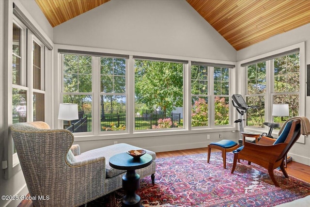 sunroom / solarium featuring high vaulted ceiling, wood finished floors, and wood ceiling