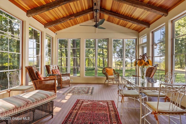 sunroom featuring hardwood / wood-style floors, lofted ceiling with beams, wooden ceiling, and a wooden deck