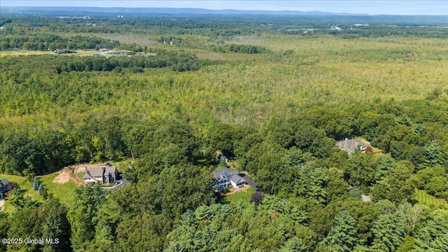 bird's eye view featuring a wooded view