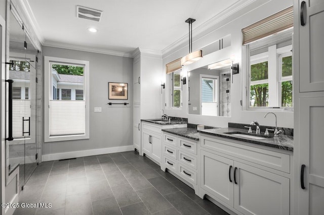 5 Winding Brook Dr, Saratoga Springs, NY 12866 - full bath with double vanity, ornamental molding, a shower stall, healthy amount of natural light, and tile patterned floors