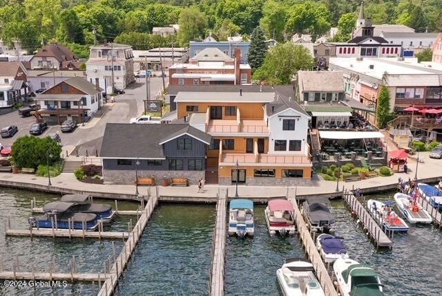 birds eye view of property with a water view