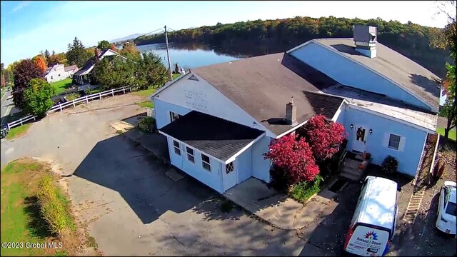 birds eye view of property with a water view