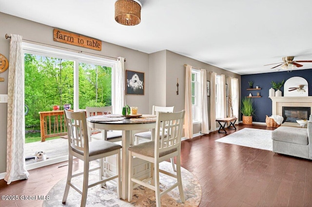 33 Sherman Way, Ballston Spa, NY 12020 - dining area with ceiling fan, wood finished floors, and a glass covered fireplace