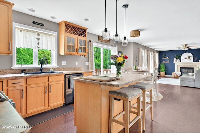 33 Sherman Way, Ballston Spa, NY 12020 - kitchen featuring dishwashing machine, a sink, a ceiling fan, a kitchen island, and a breakfast bar