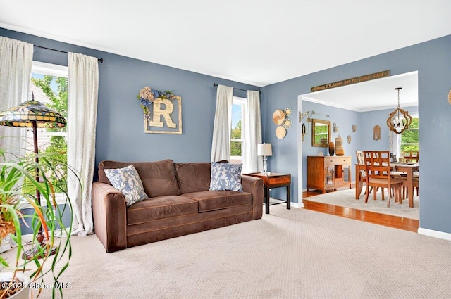 33 Sherman Way, Ballston Spa, NY 12020 - living area with a chandelier, carpet, and healthy amount of natural light