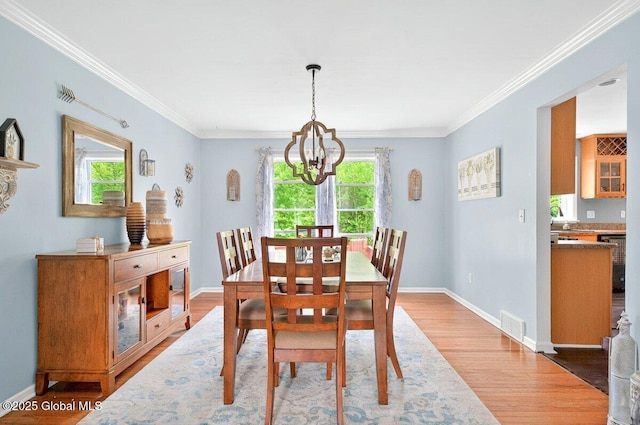 33 Sherman Way, Ballston Spa, NY 12020 - dining area featuring a chandelier, light wood finished floors, crown molding, and baseboards